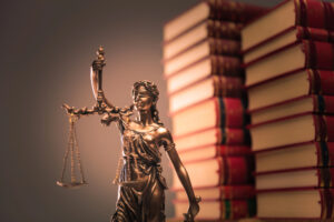 domestic assault penalties books and lady justice image